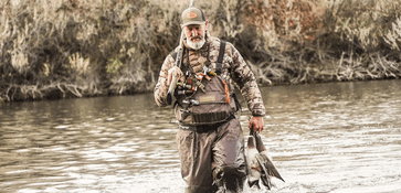 CEO, Bill Ayer duck hunting in water
