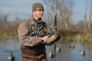 Hunter with decoy for hunting wood ducks