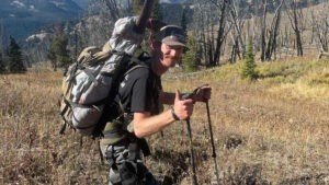 Slayer friend and elk hunter, Robert Albers hiking the mountainside.