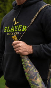 Hunter holding Slayer Calls ArchAngel acrylic bugle tube with bugle tube strap