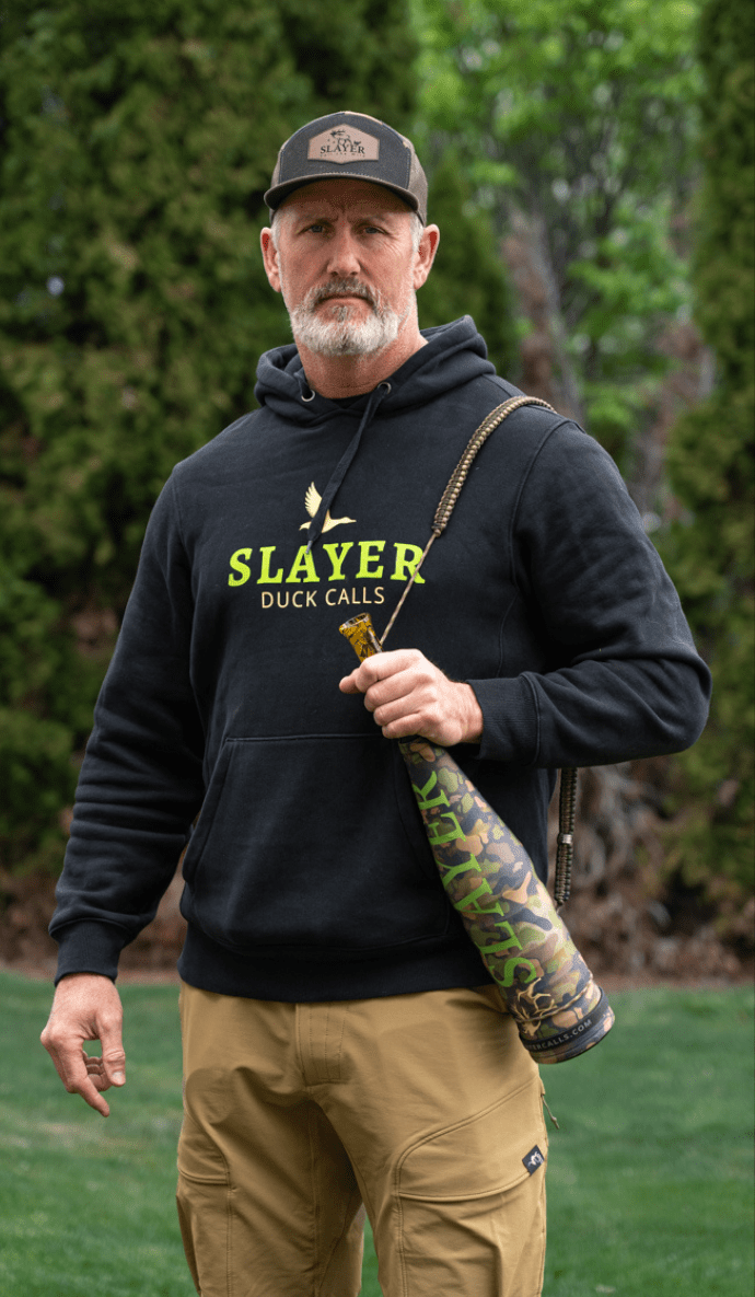 Hunter holding Slayer Calls ArchAngel acrylic bugle tube with bugle tube strap