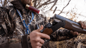 Image of shotgunner, duck hunter holding shotgun